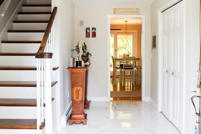 an entryway with a mirror