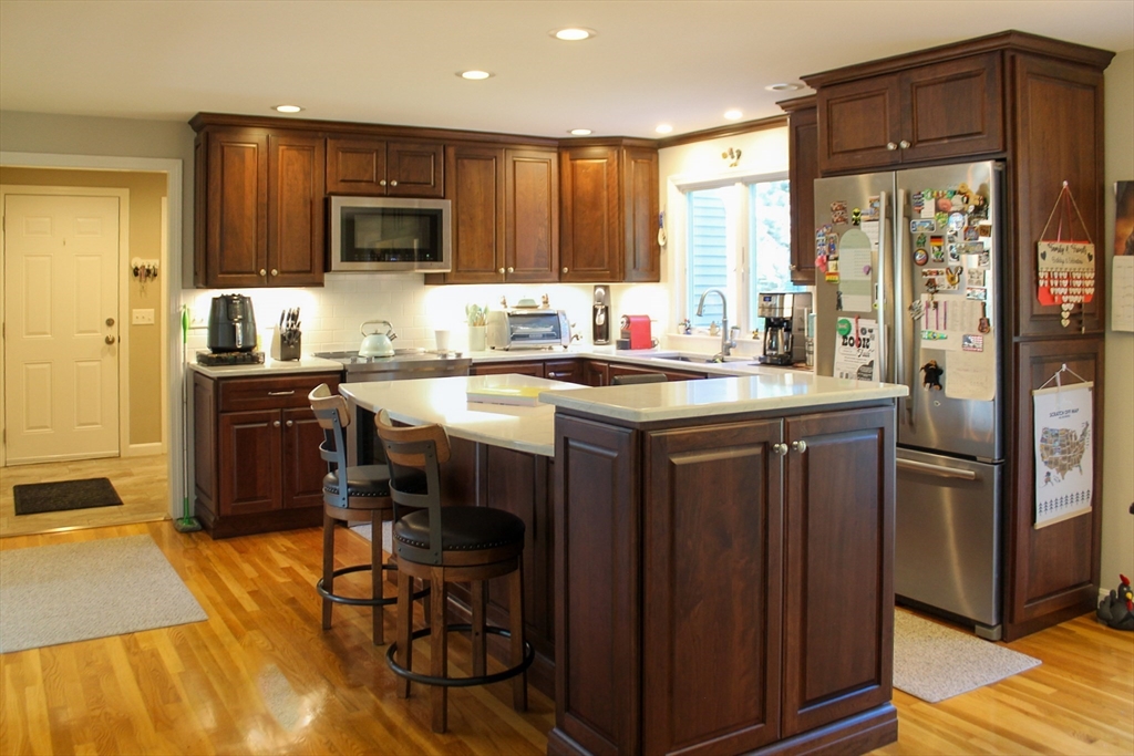 2 Applewood Circle Shrewsbury, MA 01545 - Photo 7 of 40 a kitchen with stainless steel appliances granite countertop a stove a sink and a refrigerator
