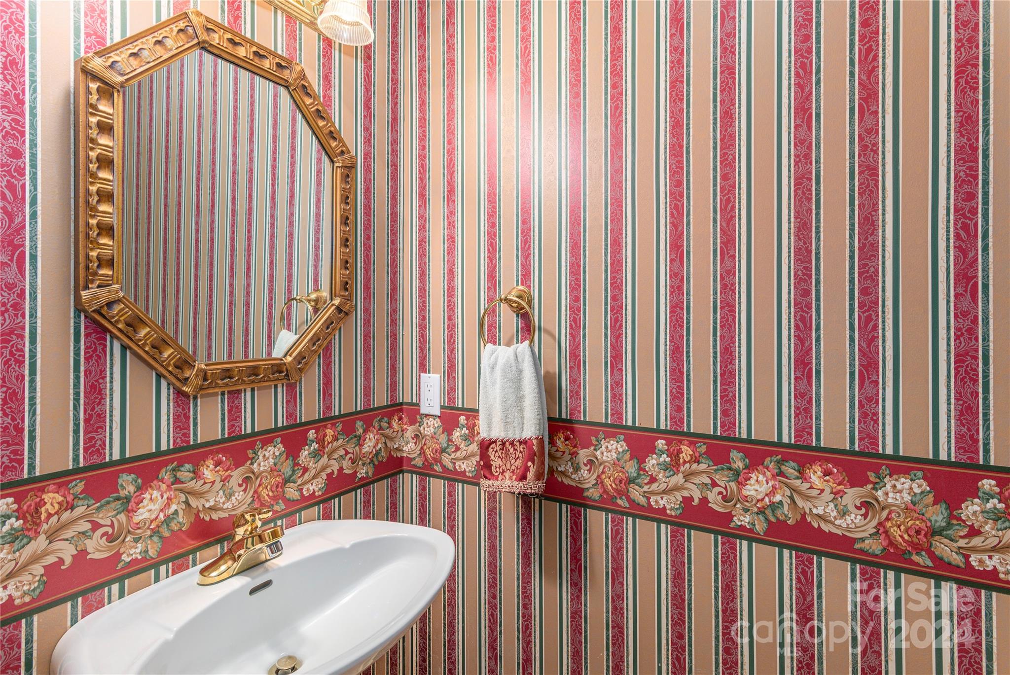 3191 Pigeon Road Waynesville, NC 28786 - Photo 15 of 33 a bathroom with a sink and a mirror