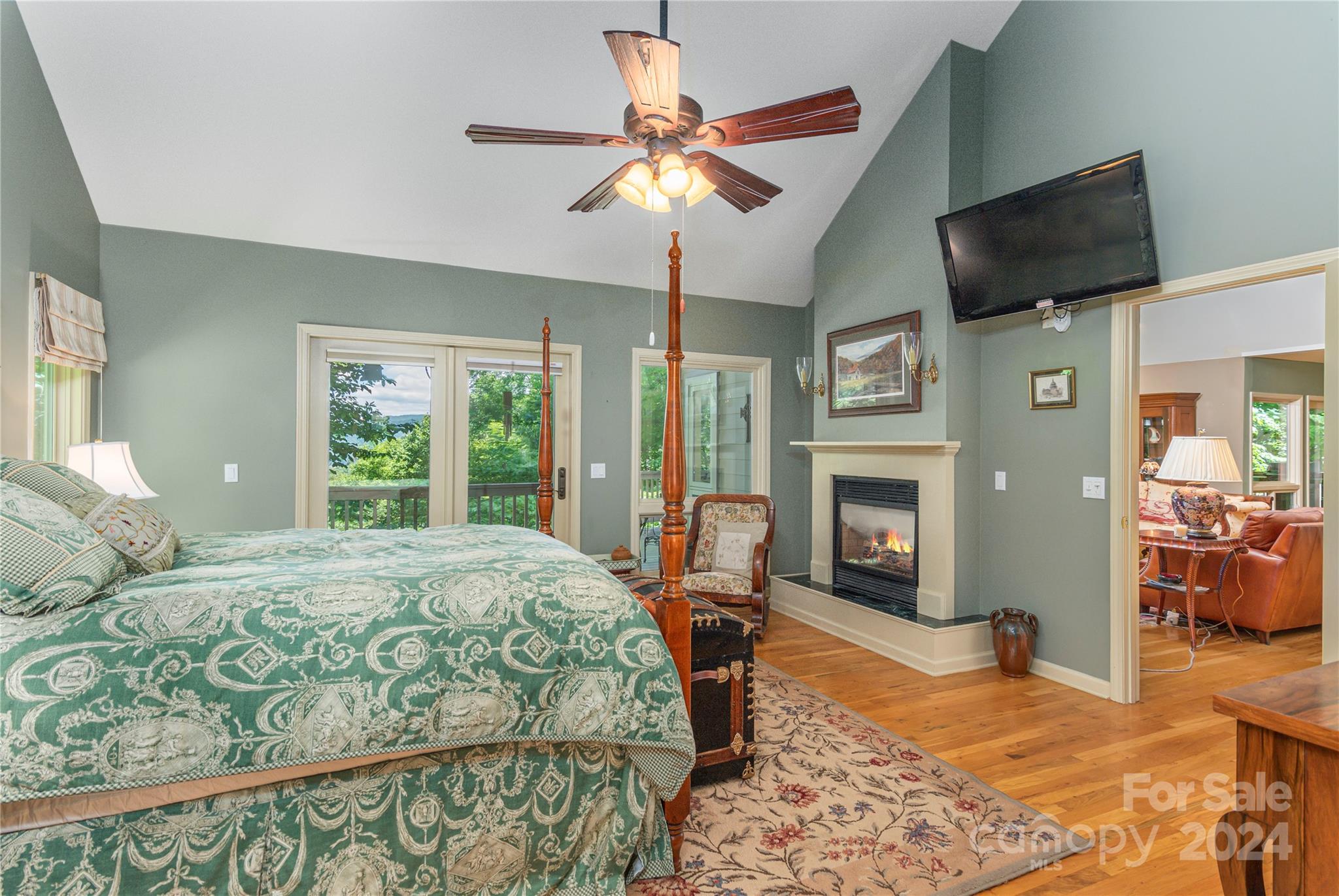 3191 Pigeon Road Waynesville, NC 28786 - Photo 17 of 33 a bedroom with a bed and wooden floor
