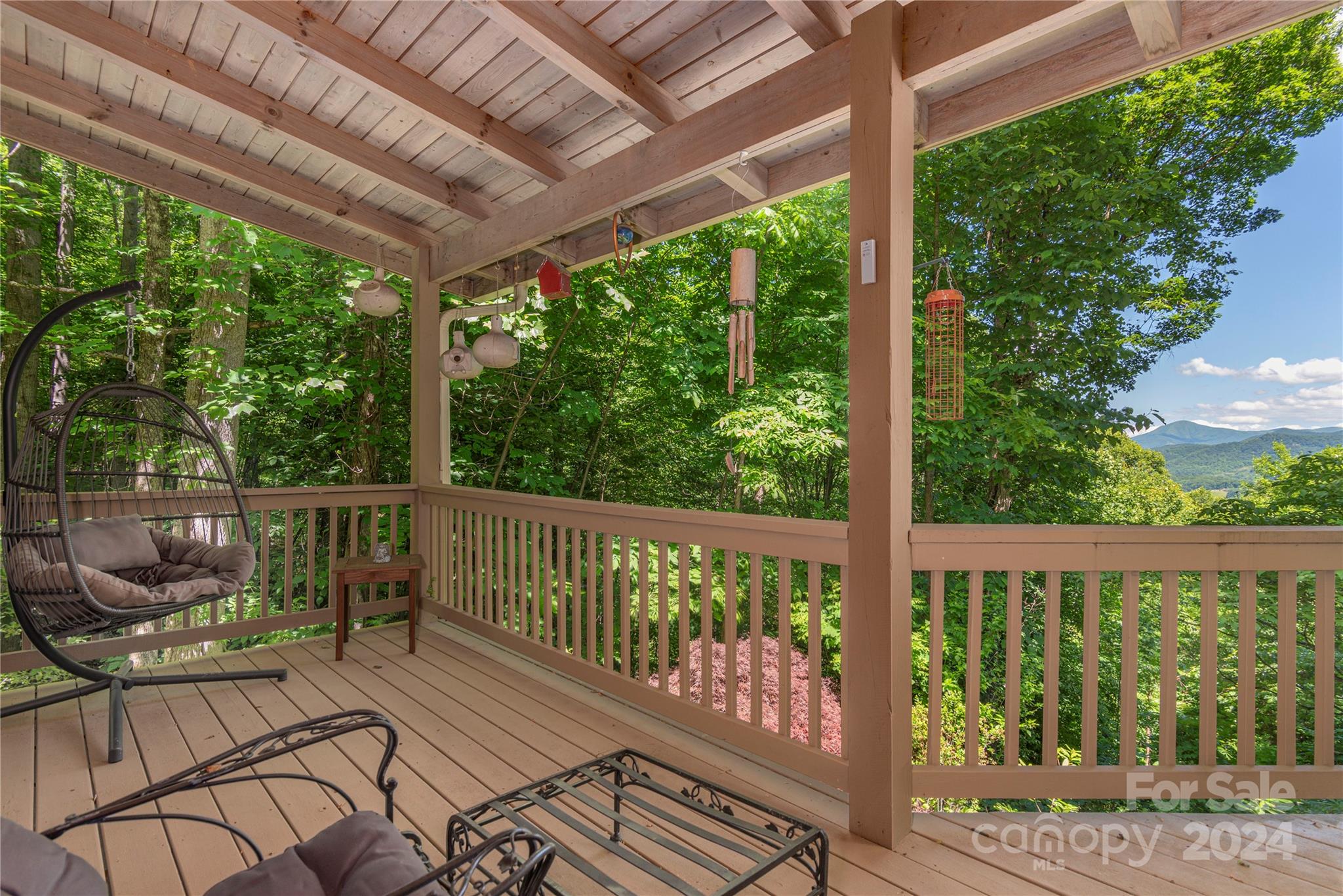 3191 Pigeon Road Waynesville, NC 28786 - Photo 19 of 33 a view of a two chairs in the deck