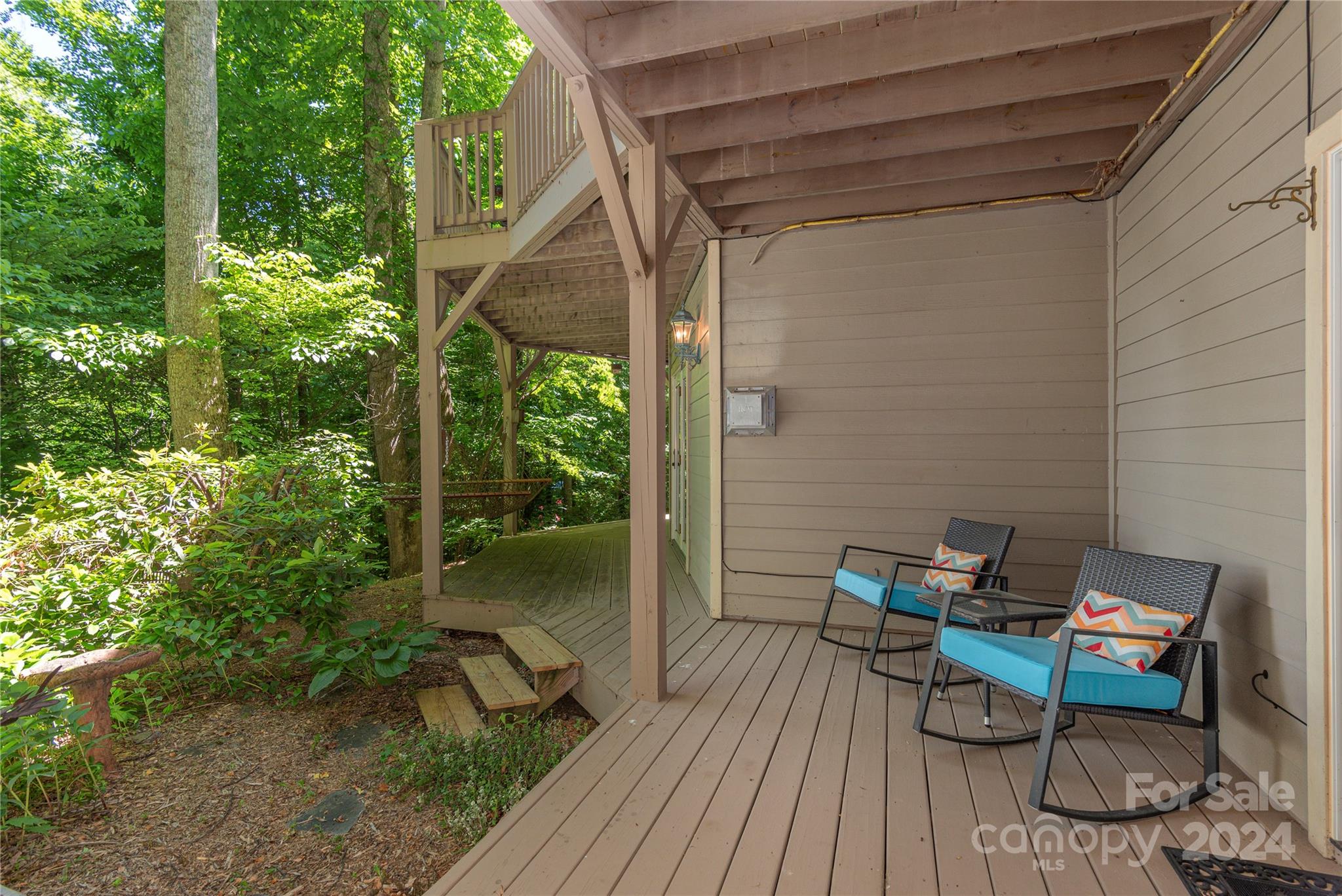 3191 Pigeon Road Waynesville, NC 28786 - Photo 27 of 33 a view of a balcony with chairs and wooden floor