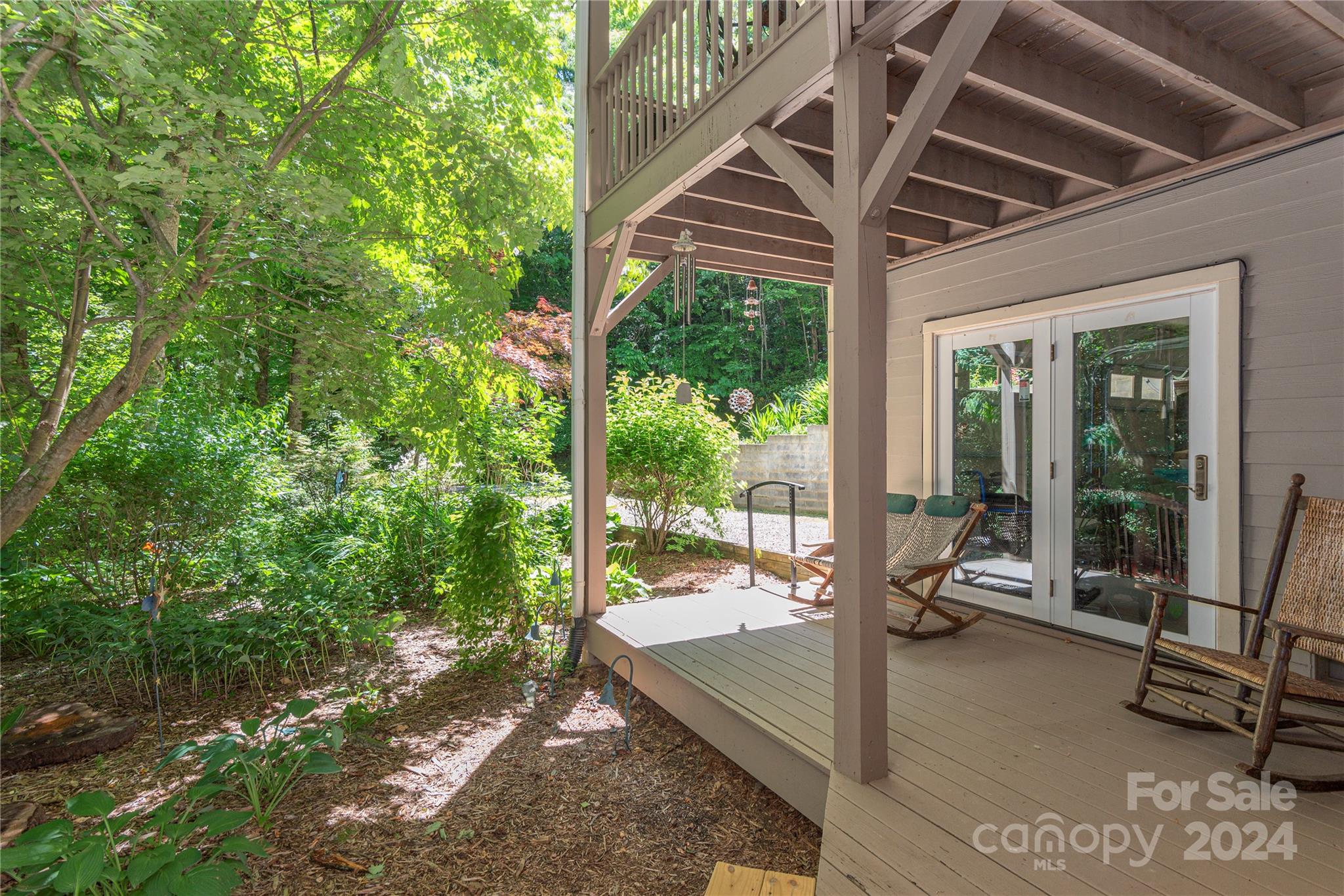 3191 Pigeon Road Waynesville, NC 28786 - Photo 30 of 33 a view of a porch with furniture and a yard