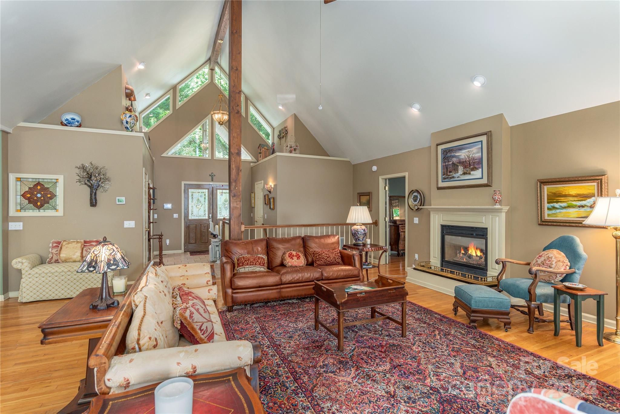 3191 Pigeon Road Waynesville, NC 28786 - Photo 6 of 33 a living room with furniture and a fireplace