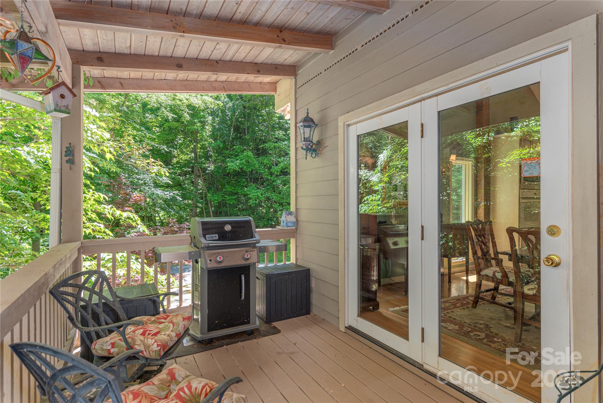 3191 Pigeon Road Waynesville, NC 28786 - Photo 8 of 33 a view of a chairs and table in the balcony