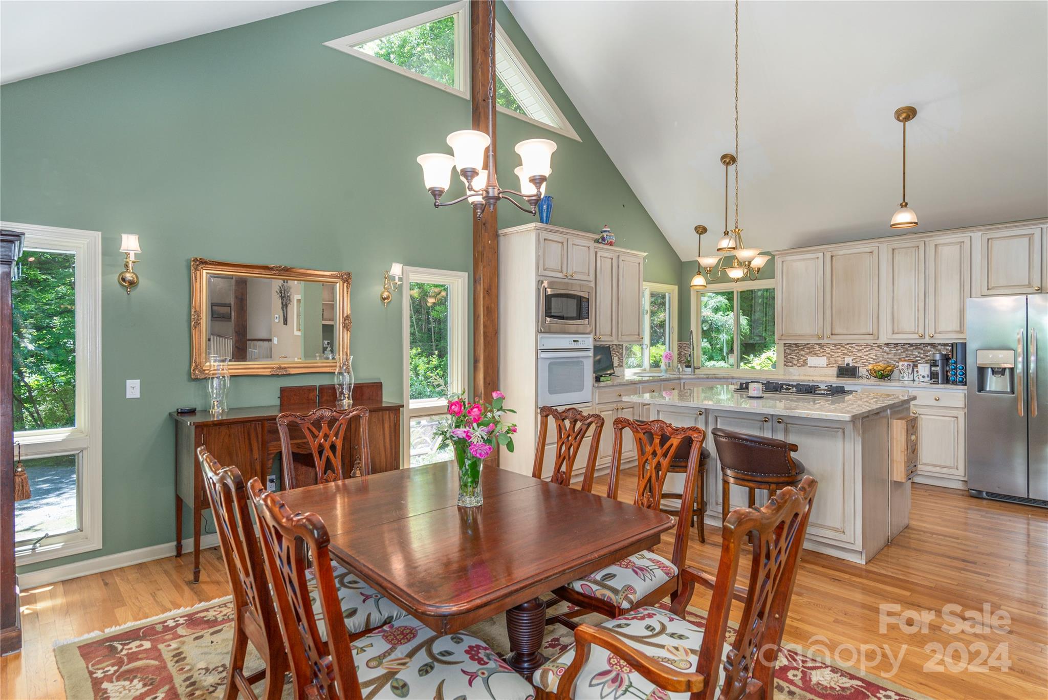 3191 Pigeon Road Waynesville, NC 28786 - Photo 10 of 33 a view of a dining room with furniture window and wooden floor