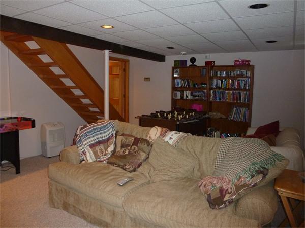 20 Dodge Road Marblehead, MA 01945 - Photo 15 of 16 a bed room with a bed and a couch
