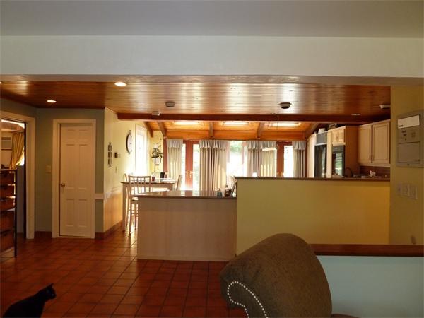 20 Dodge Road Marblehead, MA 01945 - Photo 7 of 16 a kitchen with stainless steel appliances granite countertop a refrigerator a sink dishwasher a stove and a dining table with wooden floor