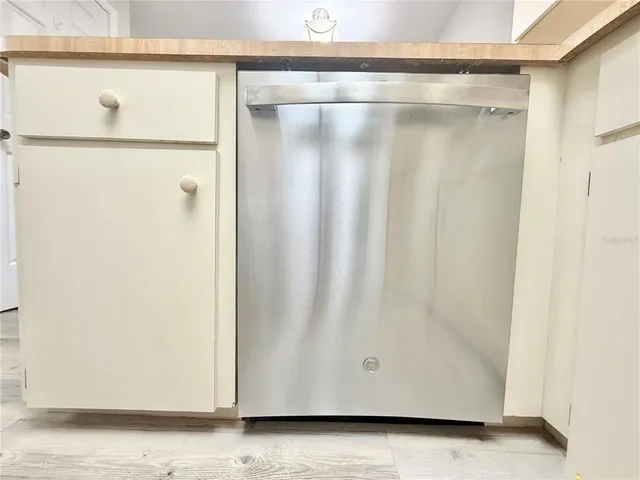 a view of a storage & utility room with a washer dryer