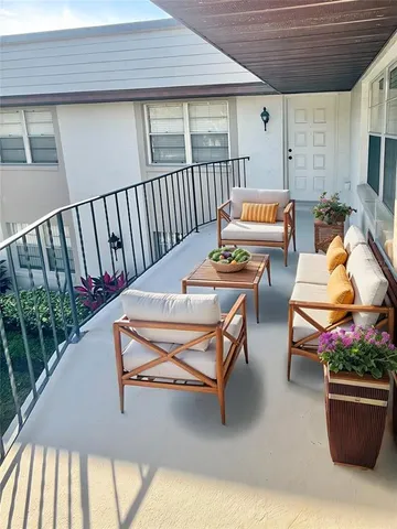 a outdoor space with patio the couches and a dining table with chairs