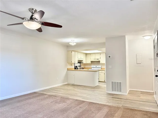 a view of kitchen with wooden floor
