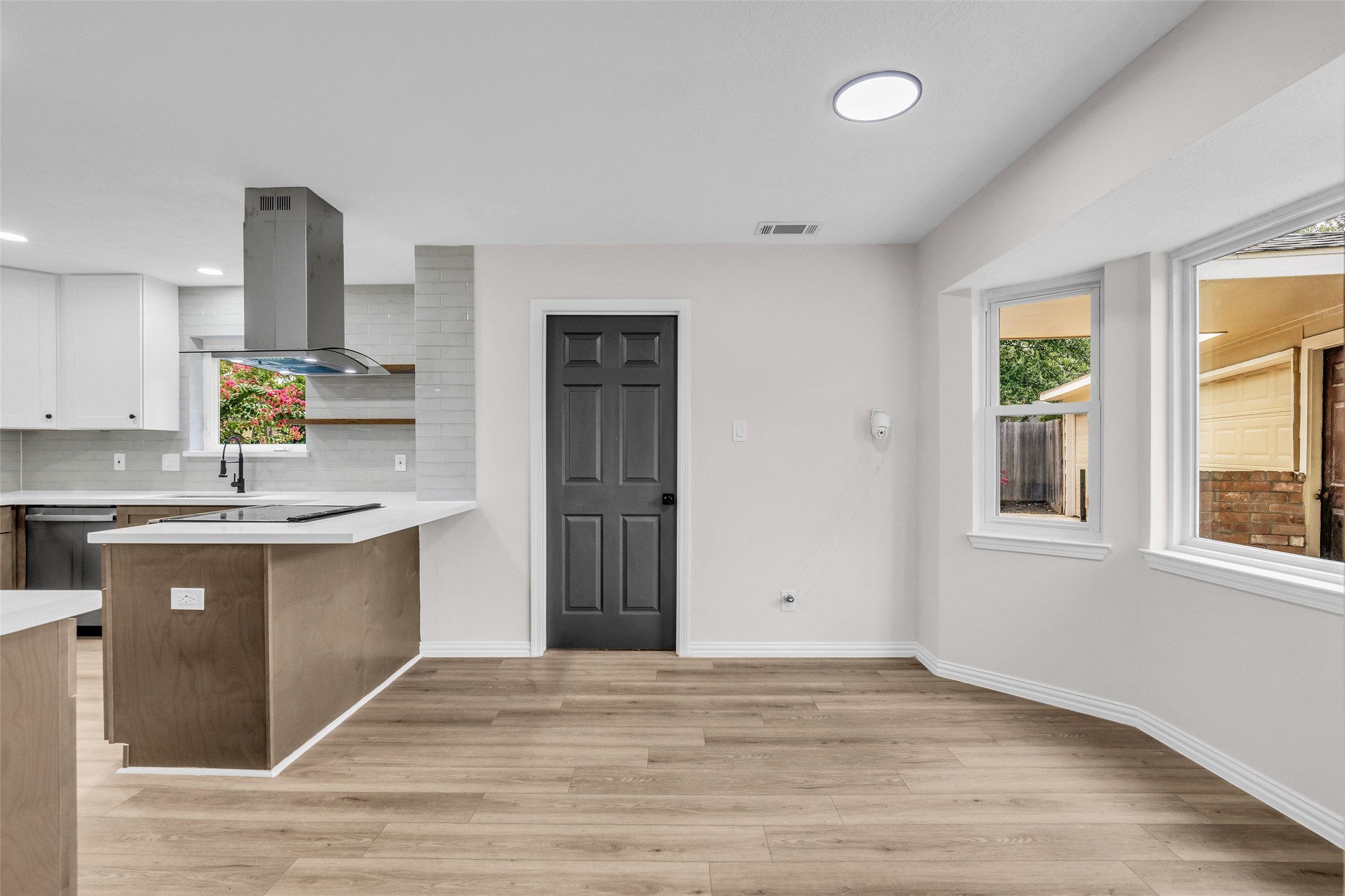 8310 Forest Ridge Road Spring, TX 77379 - Photo 12 of 25 Kitchenette area with laundry room behind the door.