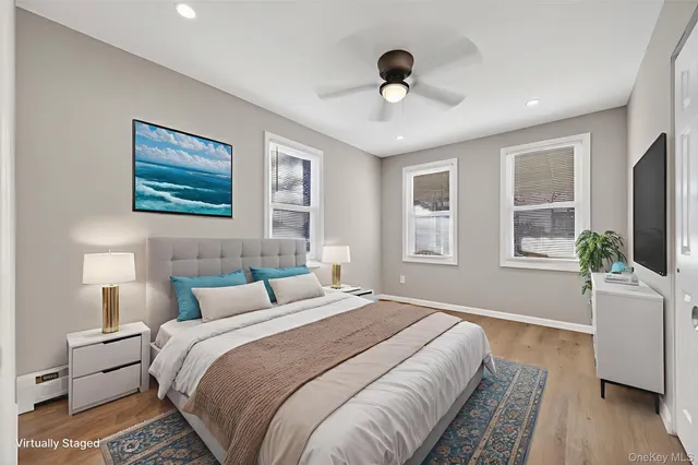 a bedroom with a large bed and a window