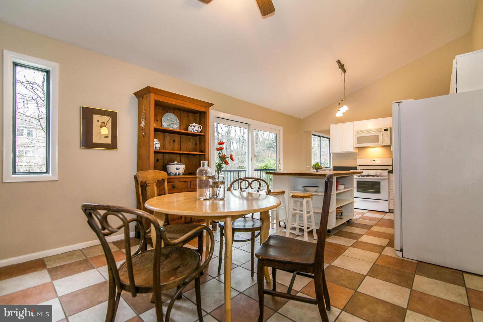 11821 Blue Spruce Road Reston, VA 20191 - Photo 7 of 28 a dining room with furniture and window