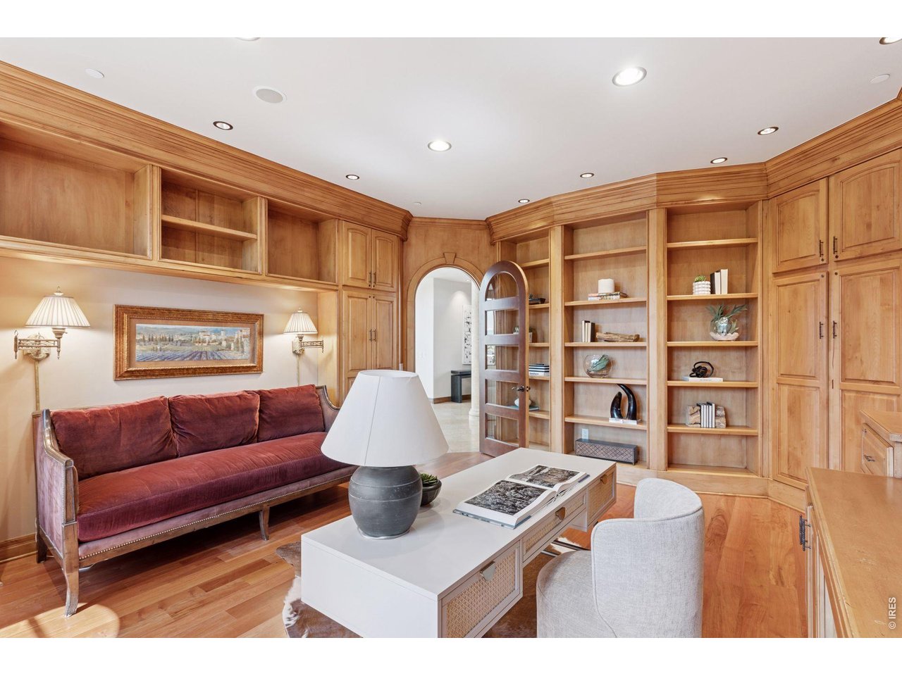 6541 Legend Ridge Trail Niwot, CO 80503 - Photo 10 of 45 Enjoy this library or home office with its rosewood flooring, custom bookcases with locking cabinets, crown moldiing and arched entry door.