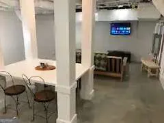 a balcony with table and chairs