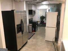 1558 Womack Road Atlanta, GA 30338 - Photo 6 of 19 a view of a refrigerator and microwave in a kitchen