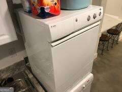 1558 Womack Road Atlanta, GA 30338 - Photo 10 of 19 a close up view of washer and dryer