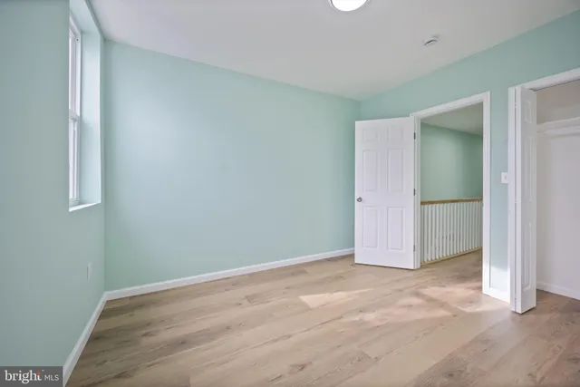 an empty room with wooden door