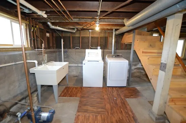 a view of a patio with table and chairs