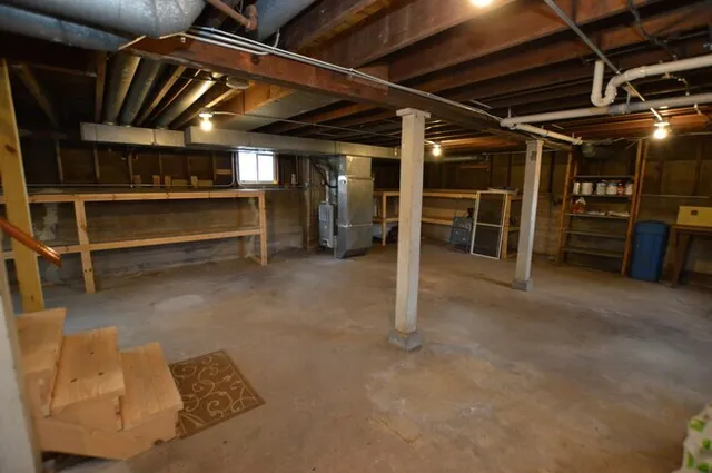a view of an empty room with storage