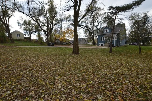 a backyard of a house with lots of green space