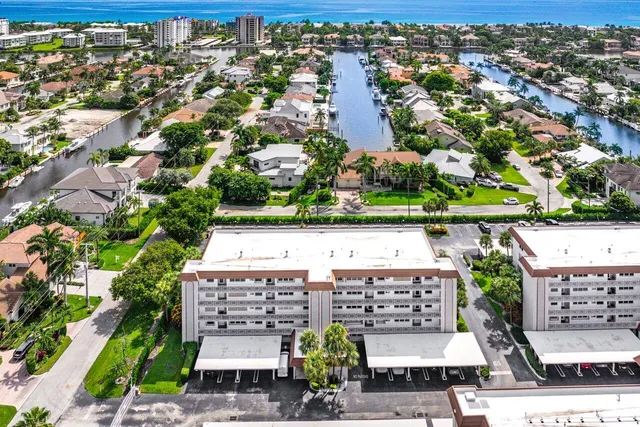 an aerial view of a house with a lake view