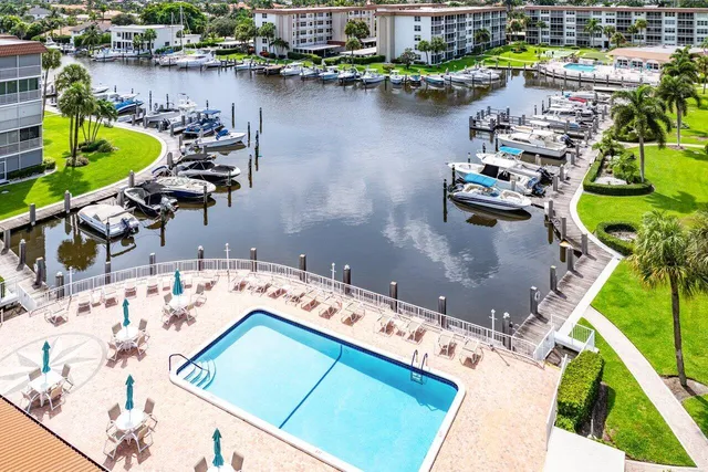 a view of a dining area with furniture and a large window