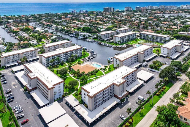 a view of a hallway with wooden floor and entryway