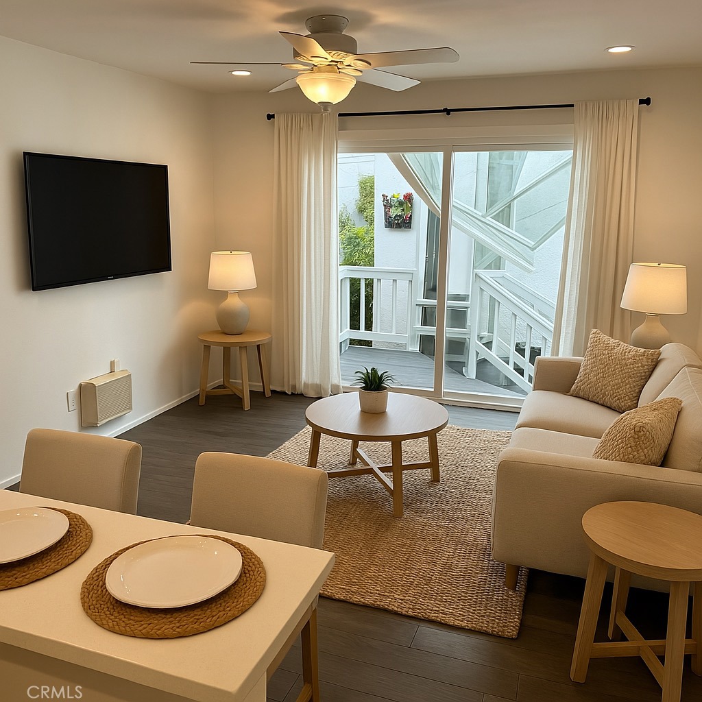 733 Manhattan Beach Boulevard, Unit B Manhattan Beach, CA 90266 - Photo 11 of 11 a living room with furniture a flat screen tv and a large window