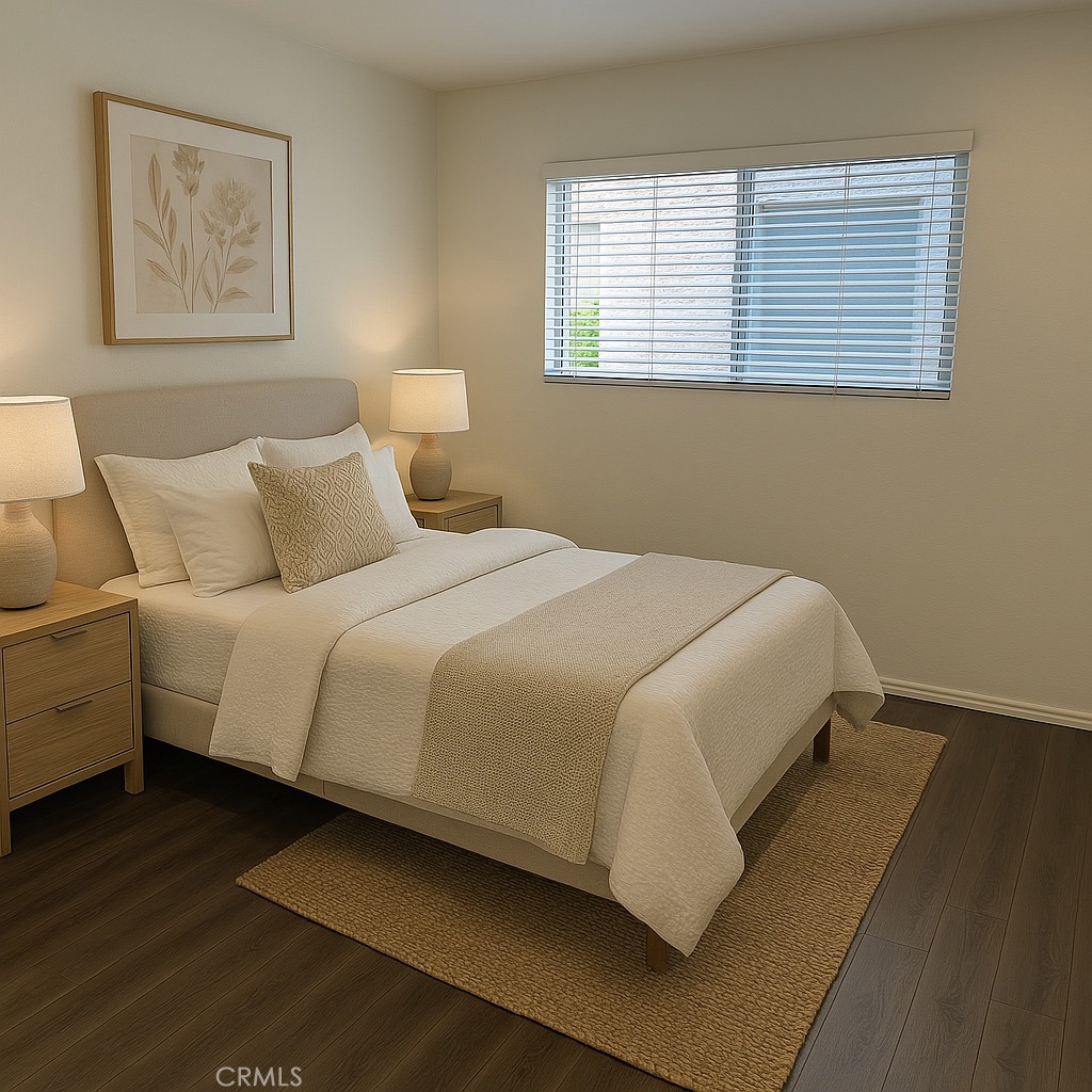 a large bed sitting in a bedroom next to a window