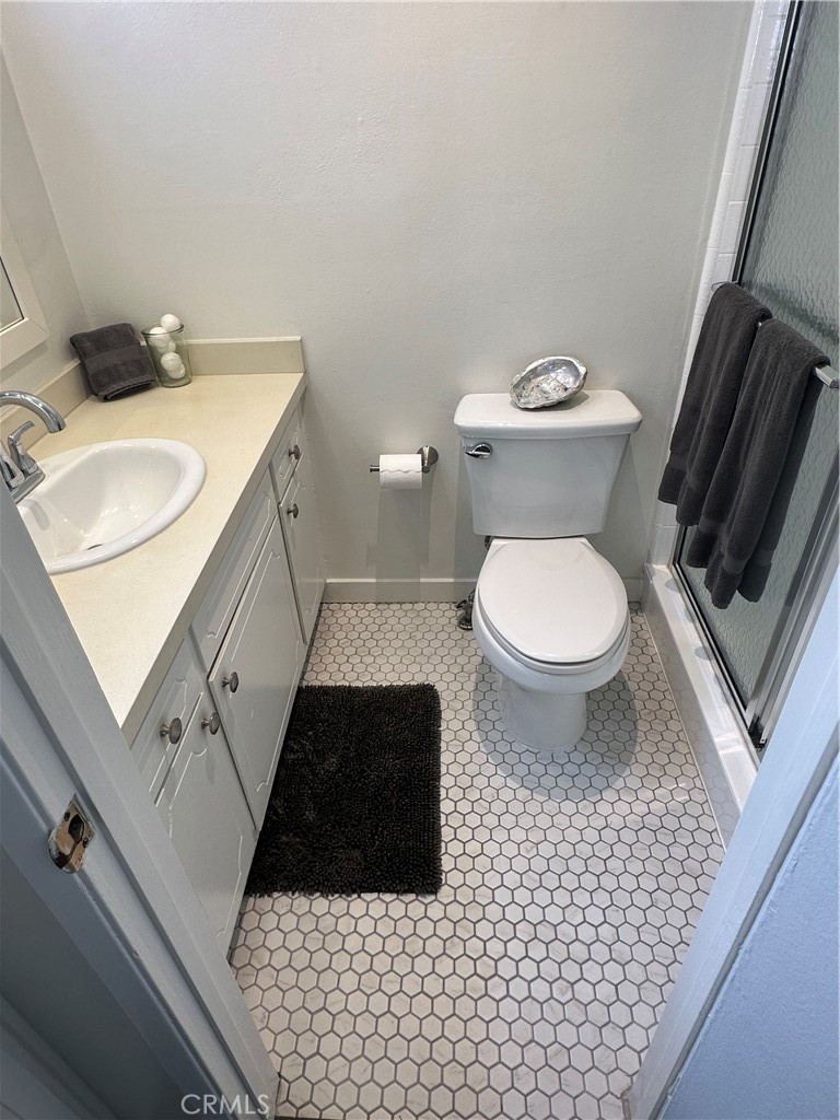 733 Manhattan Beach Boulevard, Unit B Manhattan Beach, CA 90266 - Photo 3 of 11 a bathroom with a sink a toilet and a mirror