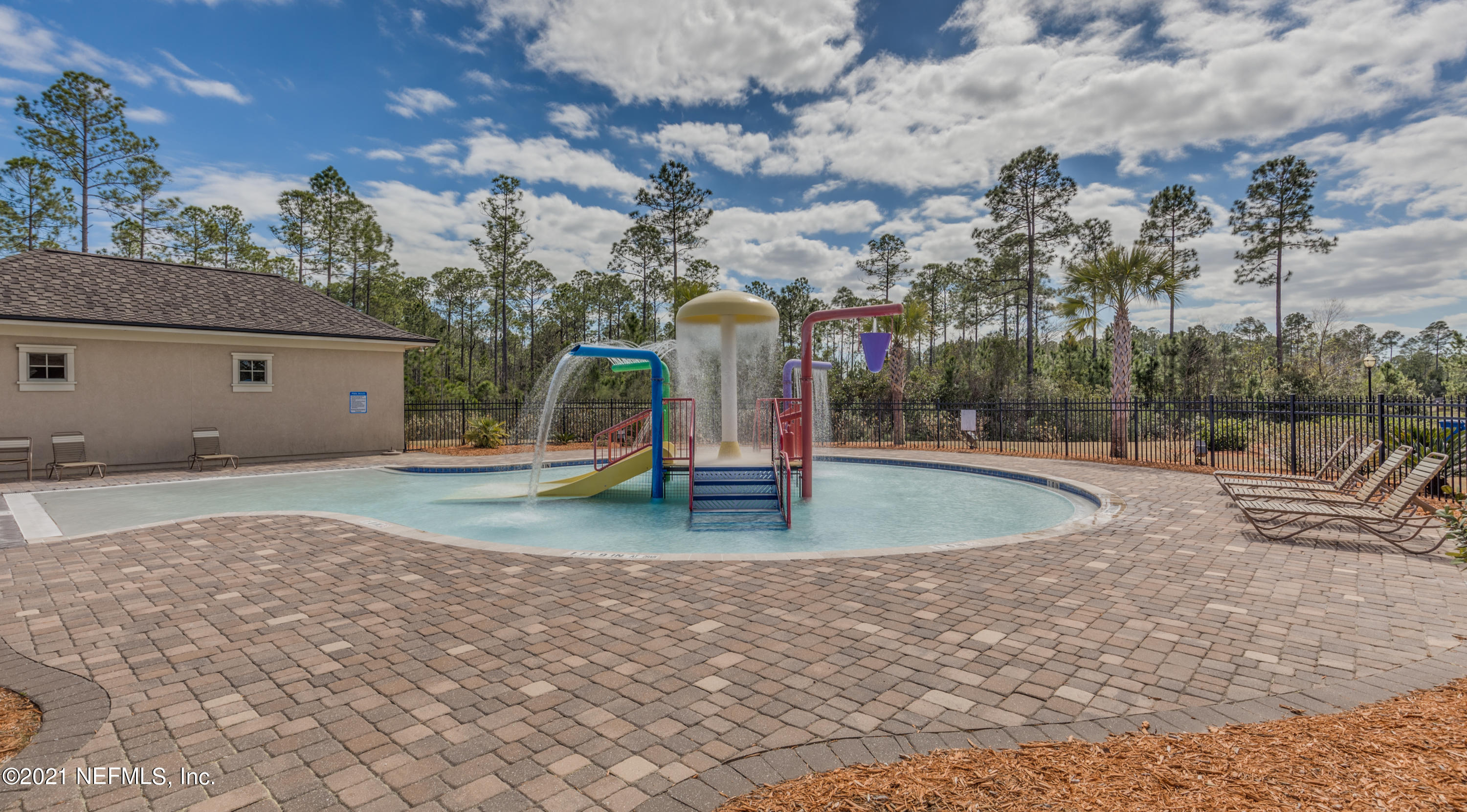 75330 Bridgewater Drive Yulee, FL 32097 - Photo 12 of 13 a view of outdoor space with playground and tree s