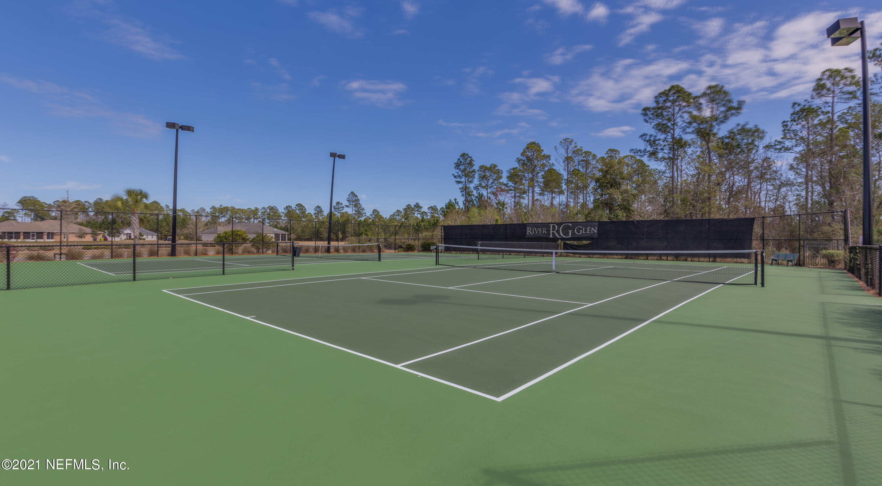 75330 Bridgewater Drive Yulee, FL 32097 - Photo 13 of 13 a view of an outdoor space and tennis court
