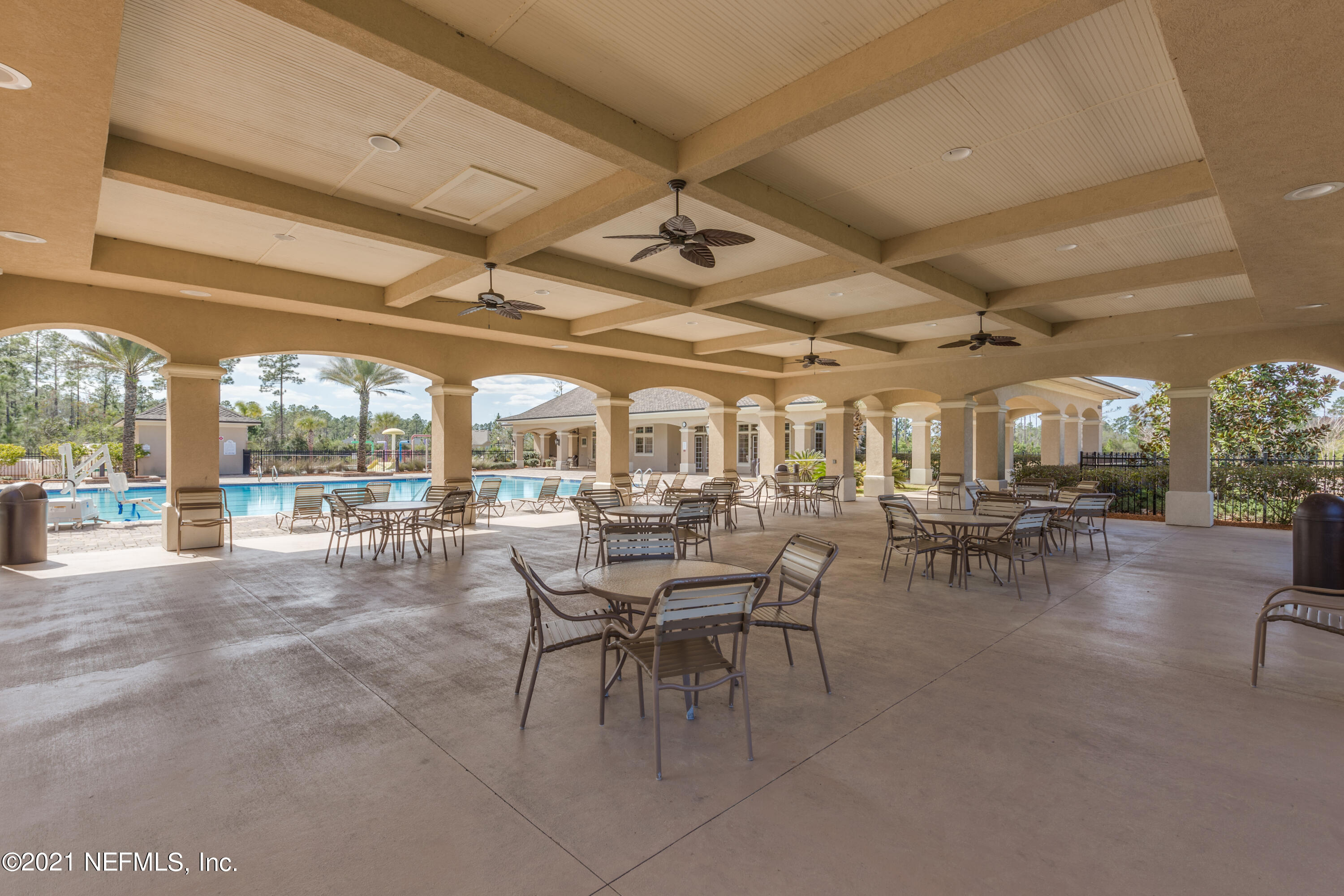 75330 Bridgewater Drive Yulee, FL 32097 - Photo 10 of 13 a outdoor space with lots of tables a garden view and chairs