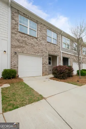 a front view of a house with yard