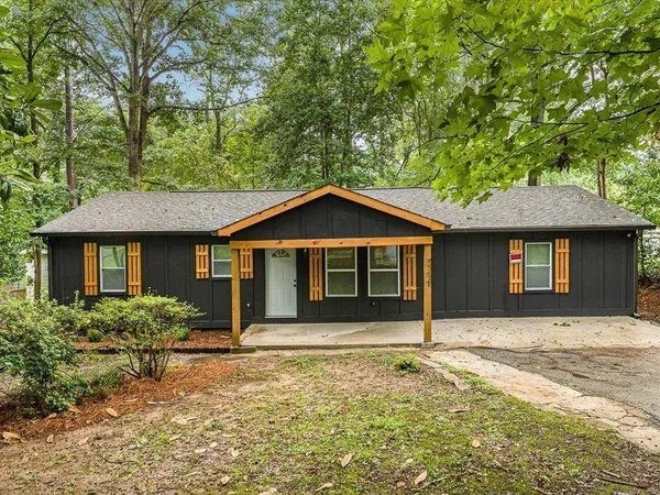 a front view of a house with yard