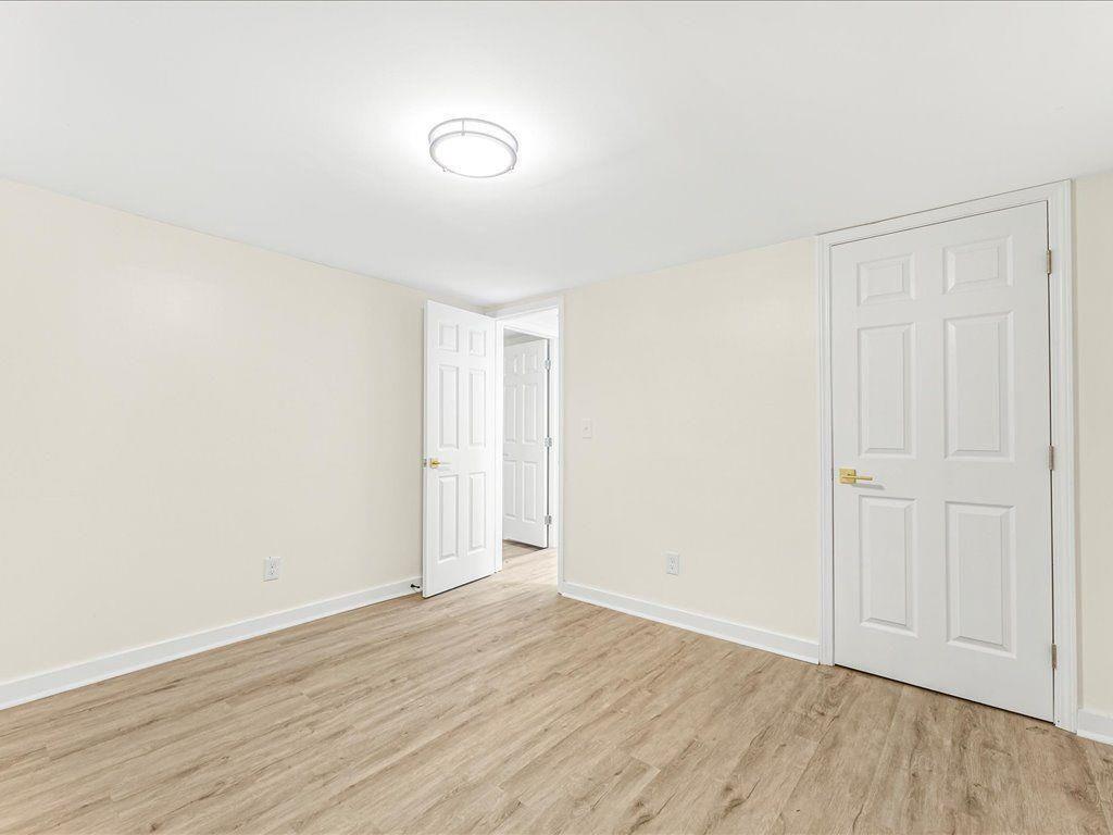 5794 Pinecrest Road Austell, GA 30168 - Photo 23 of 29 a view of an empty room and wooden floor
