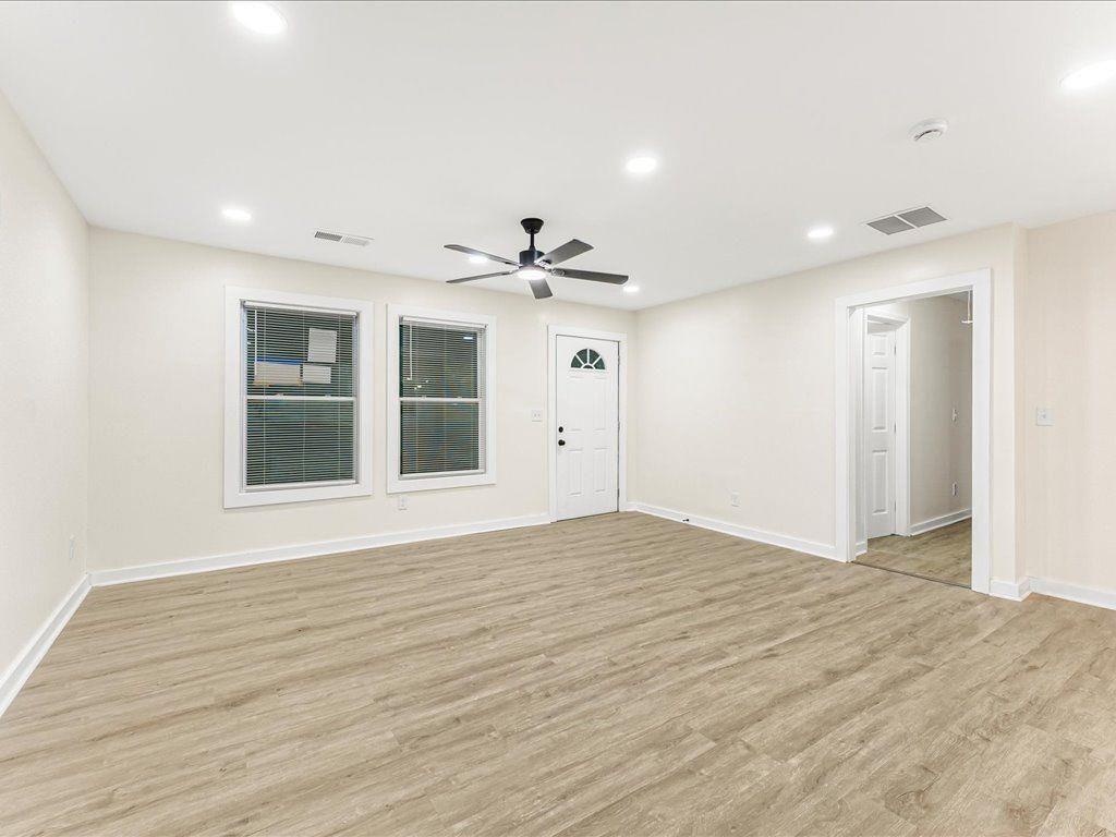 5794 Pinecrest Road Austell, GA 30168 - Photo 5 of 29 a view of an empty room with wooden floor and a window