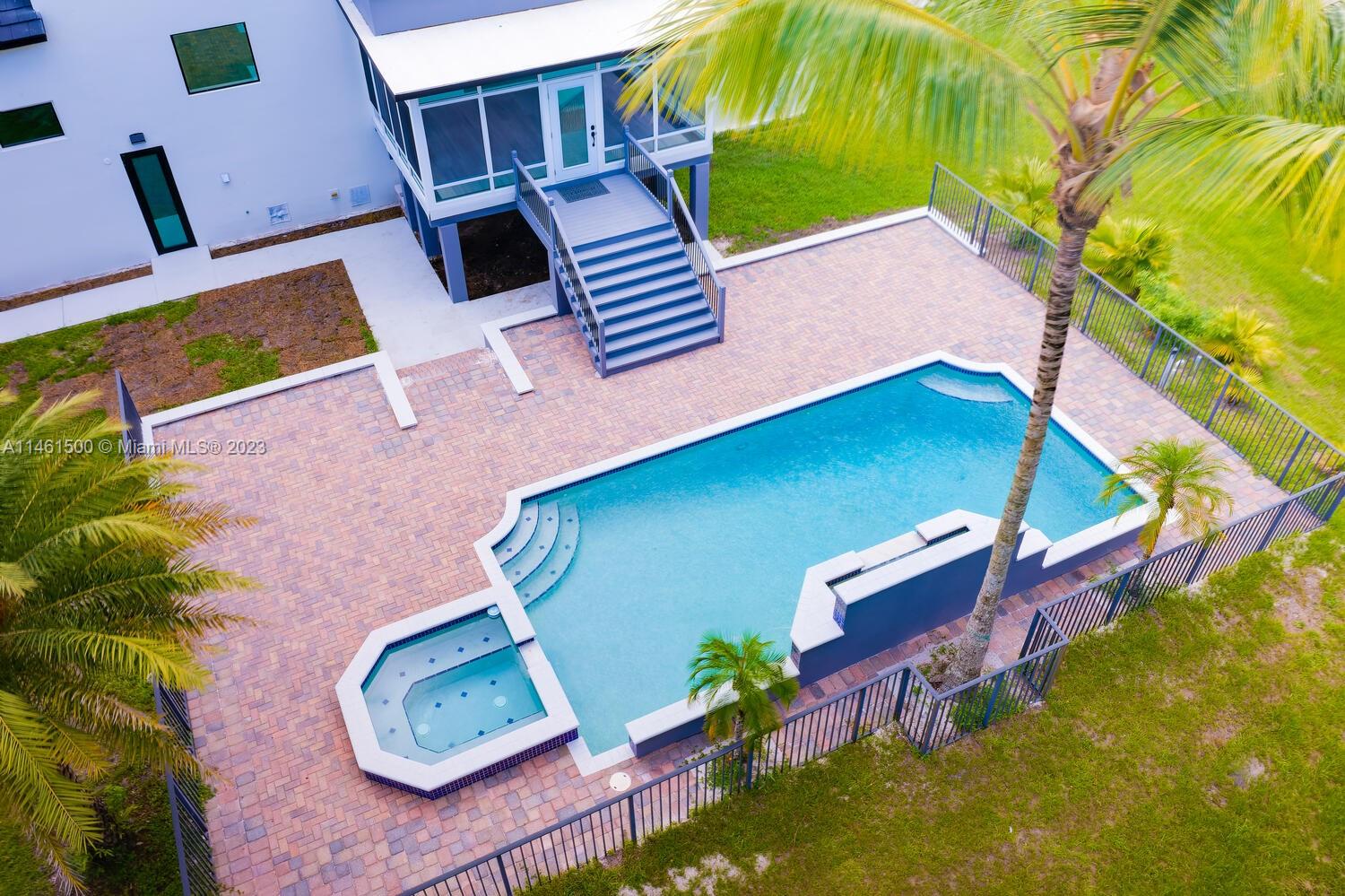 16189 Alexander Run Jupiter, FL 33478 - Photo 14 of 78 an aerial view of a house with a yard