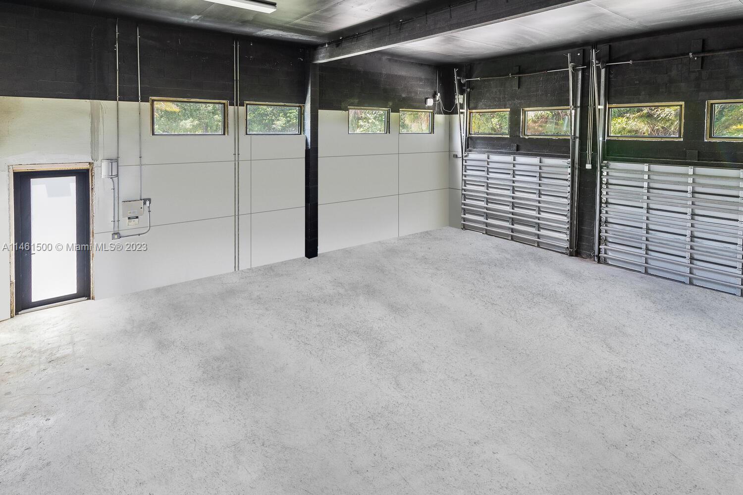 16189 Alexander Run Jupiter, FL 33478 - Photo 24 of 78 a view of an empty room with a sliding door