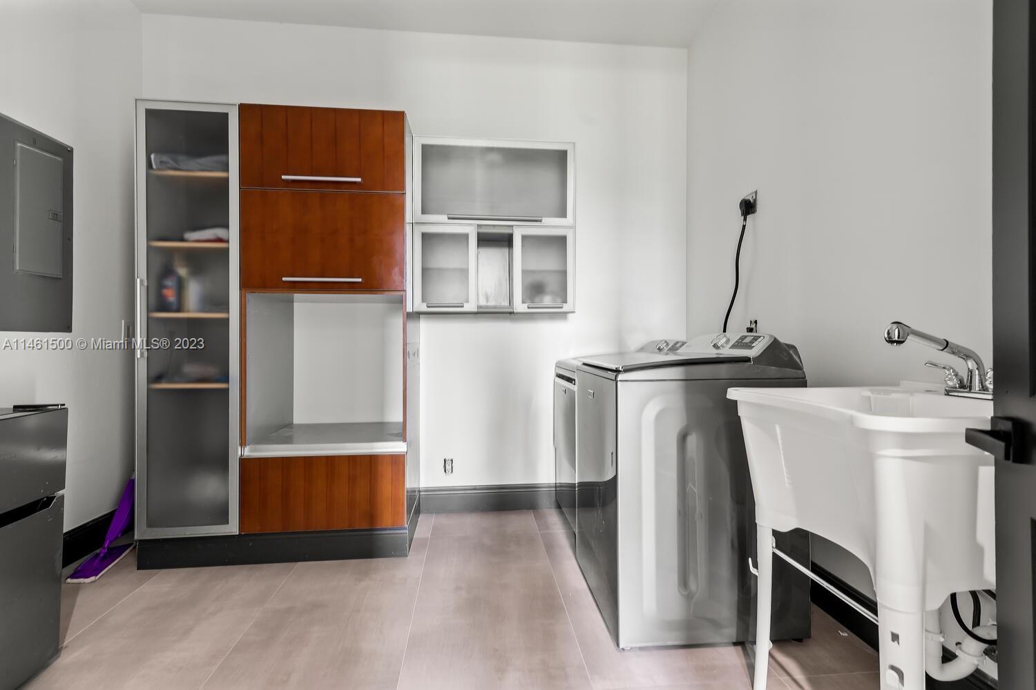 16189 Alexander Run Jupiter, FL 33478 - Photo 27 of 78 a kitchen with stainless steel appliances a refrigerator and a sink