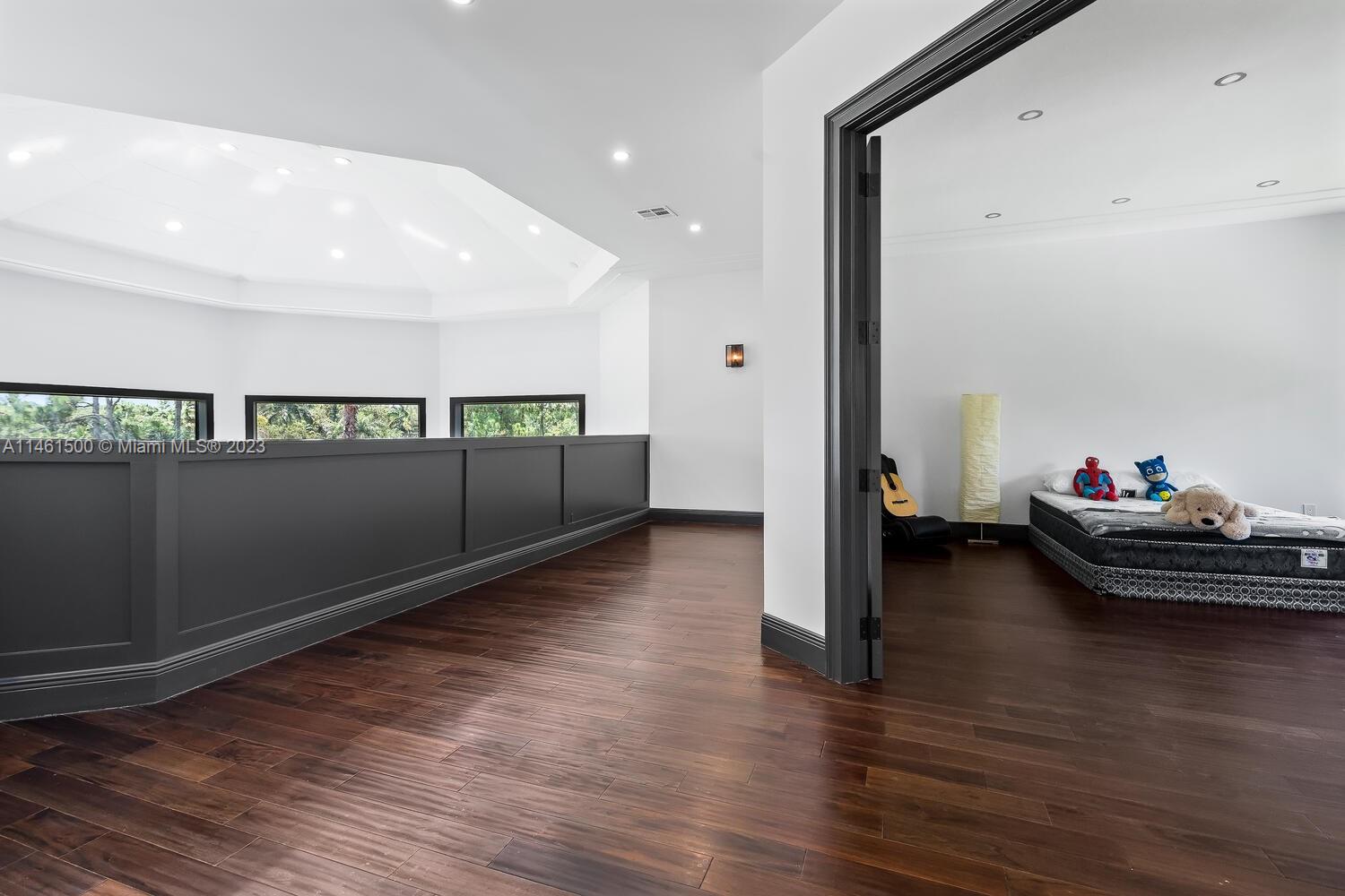 16189 Alexander Run Jupiter, FL 33478 - Photo 51 of 78 a living room with hard wood floors and a ceiling fan