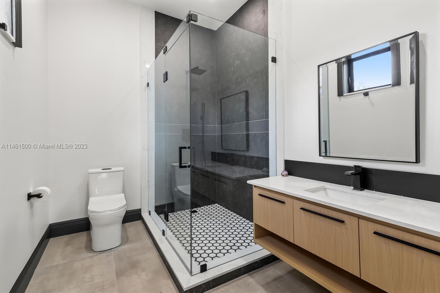 16189 Alexander Run Jupiter, FL 33478 - Photo 54 of 78 a bathroom with a sink toilet and shower