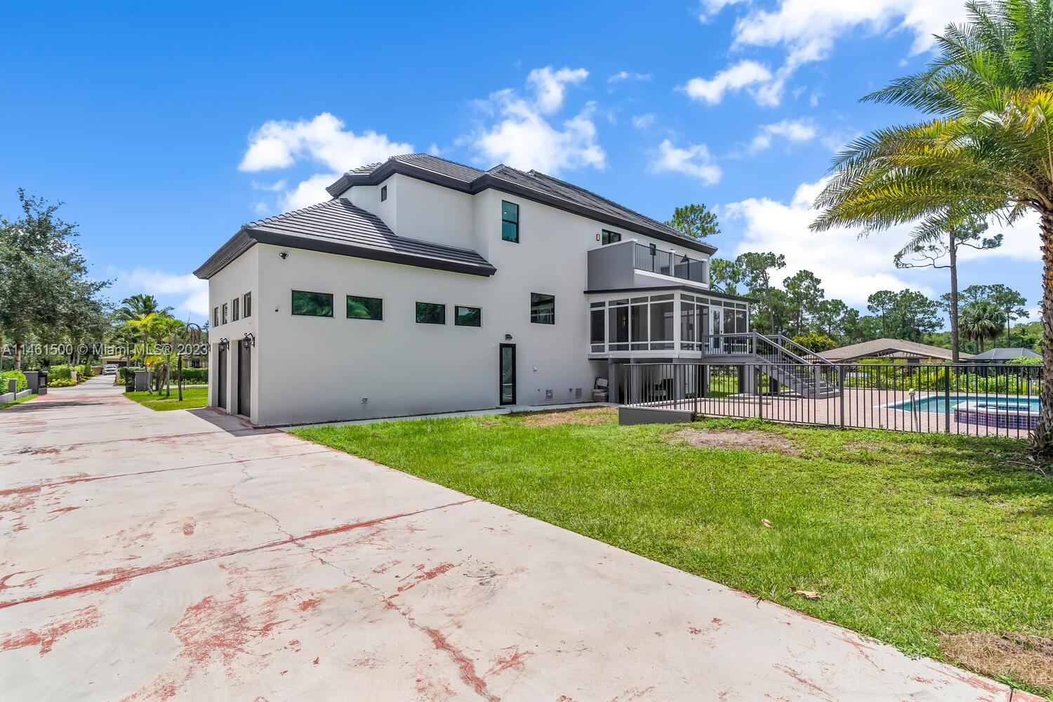 16189 Alexander Run Jupiter, FL 33478 - Photo 6 of 78 a view of a house with a yard