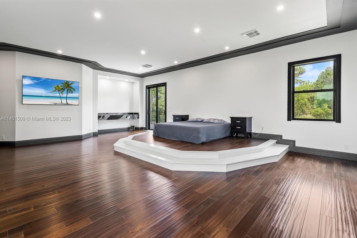 16189 Alexander Run Jupiter, FL 33478 - Photo 62 of 78 a living room with hard wood floors and a wooden floor