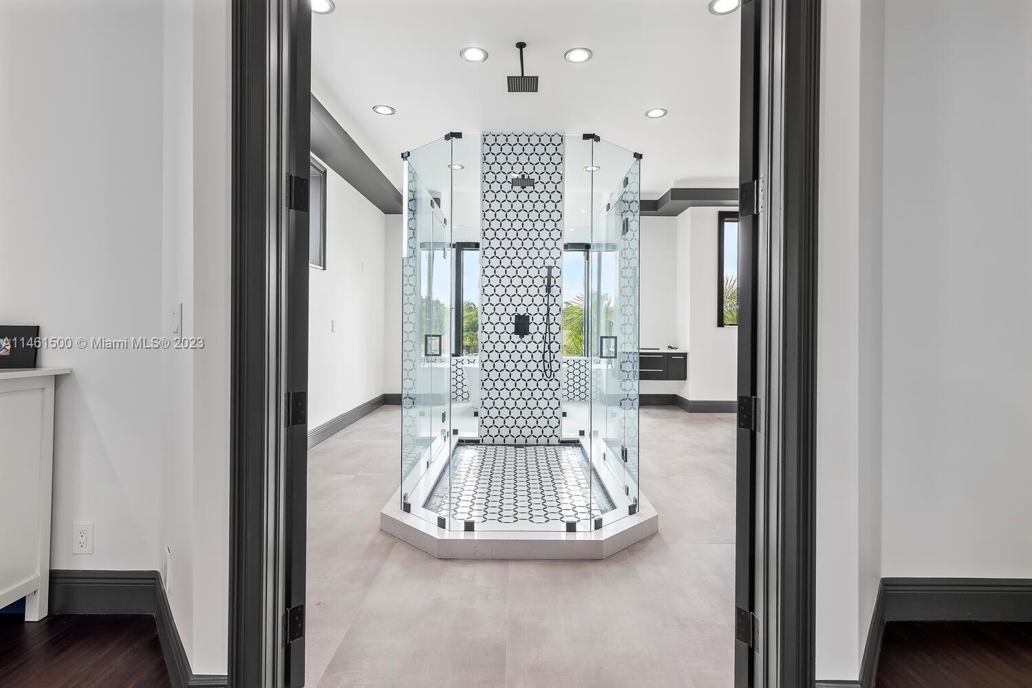 16189 Alexander Run Jupiter, FL 33478 - Photo 64 of 78 a view of a hallway with wooden floor windows and a livingroom