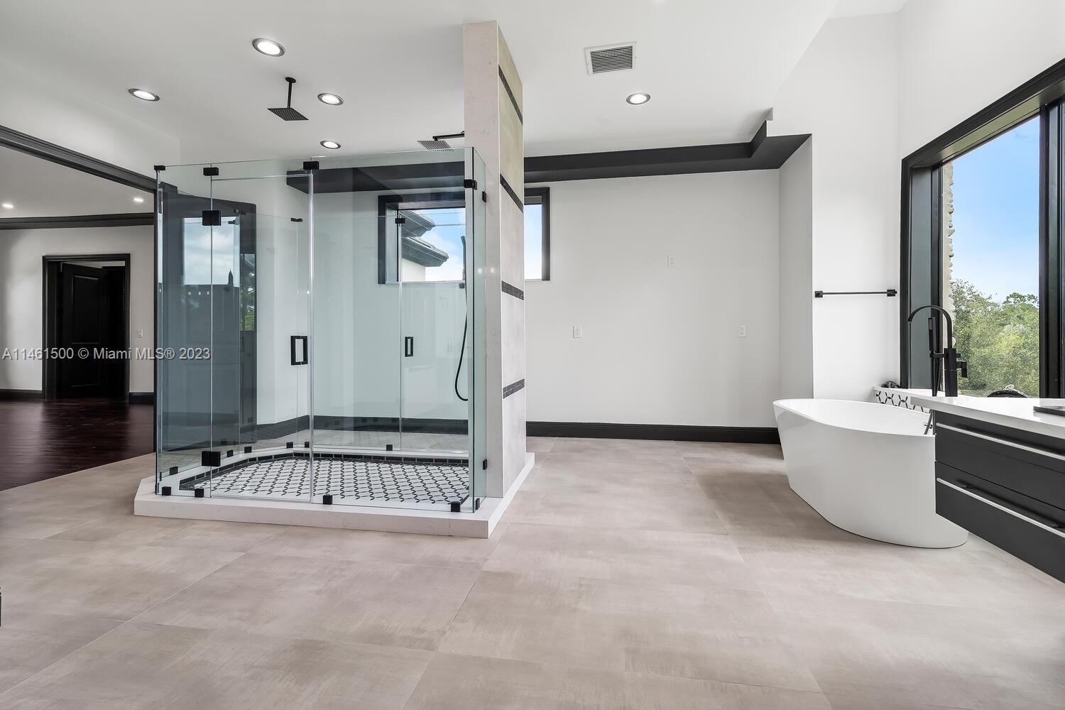 16189 Alexander Run Jupiter, FL 33478 - Photo 68 of 78 a view of a patio with table and chairs