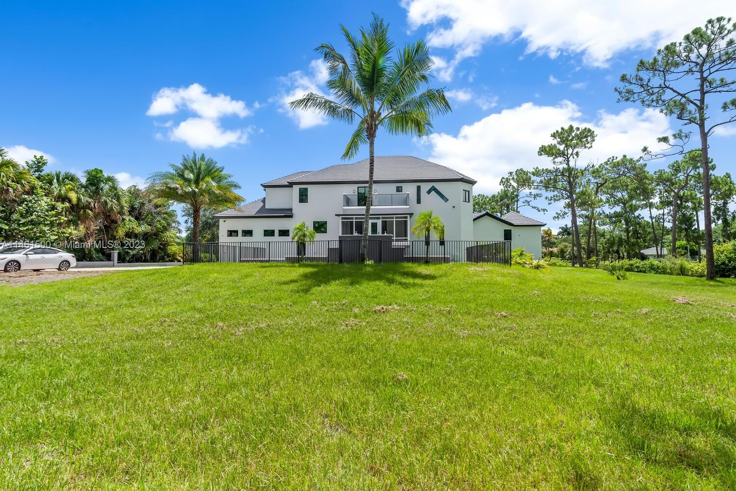 16189 Alexander Run Jupiter, FL 33478 - Photo 7 of 78 a view of a house with a yard