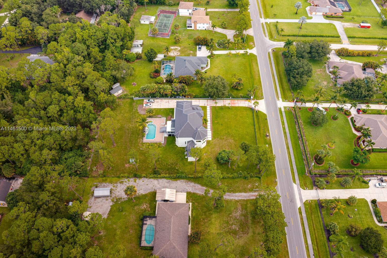 16189 Alexander Run Jupiter, FL 33478 - Photo 77 of 78 an aerial view of residential houses with outdoor space